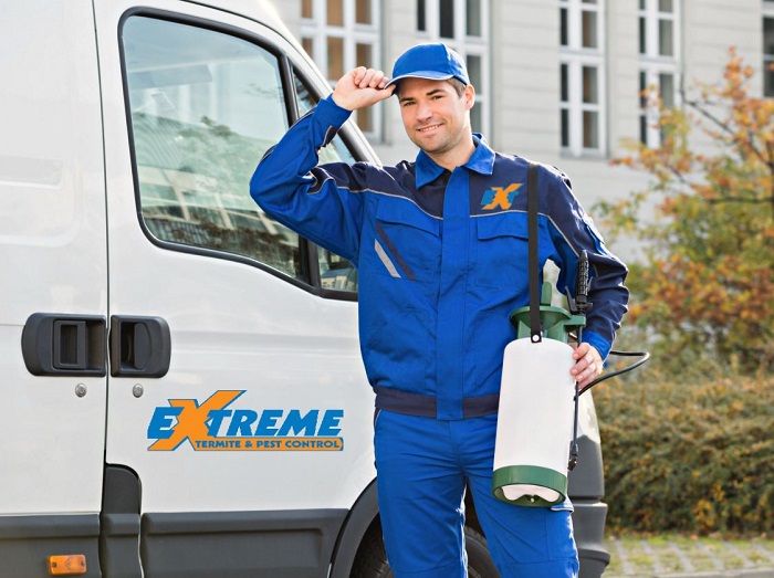 A proud pest control technician in Pensacola Fl, showcasing his commitment to service.